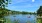 image of people on kayaks and boats out in a local lake