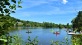 image of people on kayaks and boats out in a local lake