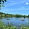image of people on kayaks and boats out in a local lake
